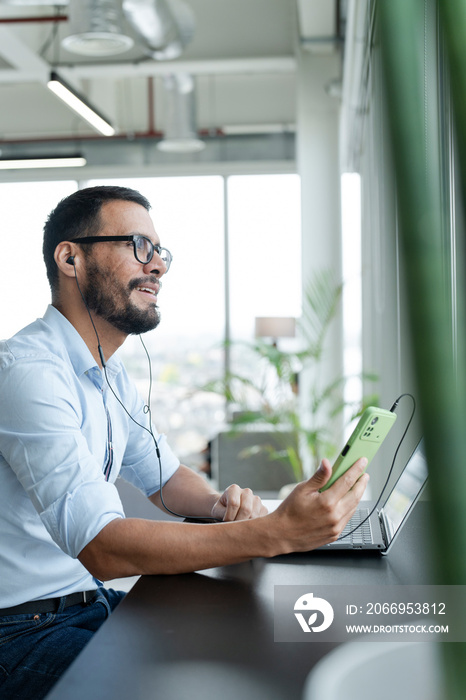 Businessman with laptop working in modern office