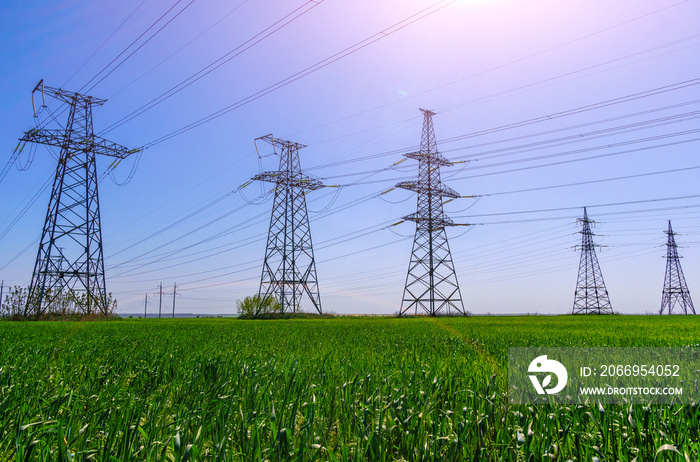 high-voltage power lines at sunset. electricity distribution station .