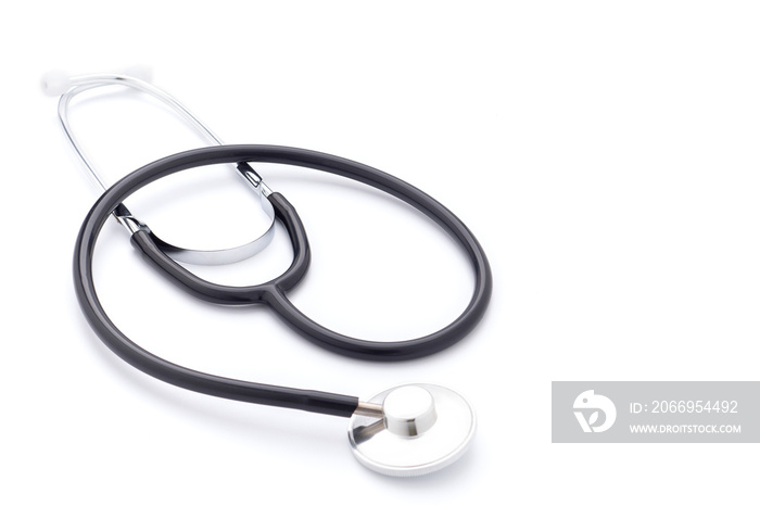 A stethoscope is placed on a white background. Top view. Space for text. Medical equipment concept