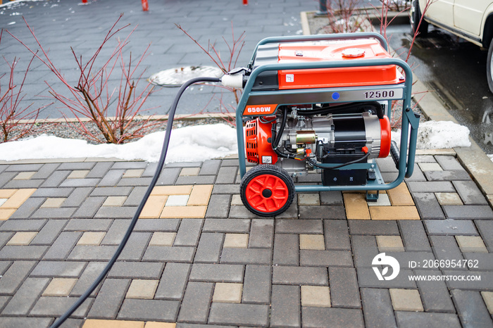 Power supply generator placed on street sidewalk. outdoor diesel power generator in Ukraine.