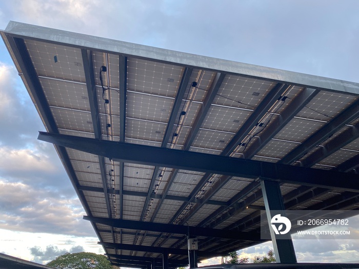 Solar paneled carport in a Hawaii parking lot help to offset high electricity costs.