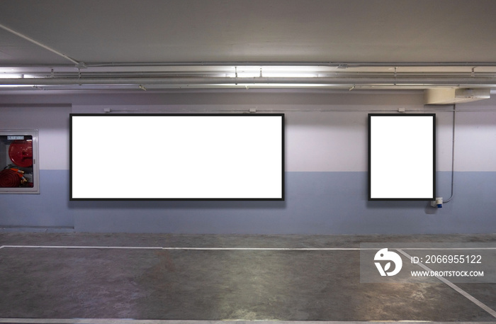 indoor car parking and empty white billboard .Blank space for text and images.