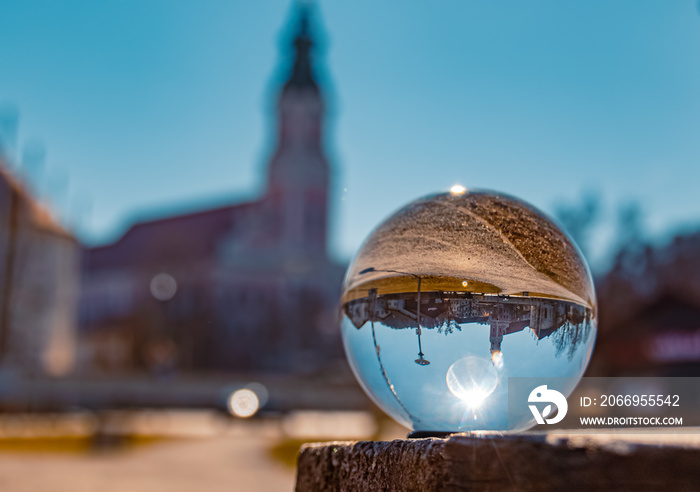 Crystal ball landscape shot with a monastery at Aldersbach, Bavaria, Germany