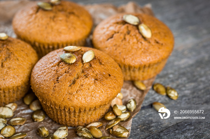 Pumpkin muffins on wooden background. Dietary product. Useful children’s dessert. Bright. Seasonal product. Diet. Recipe