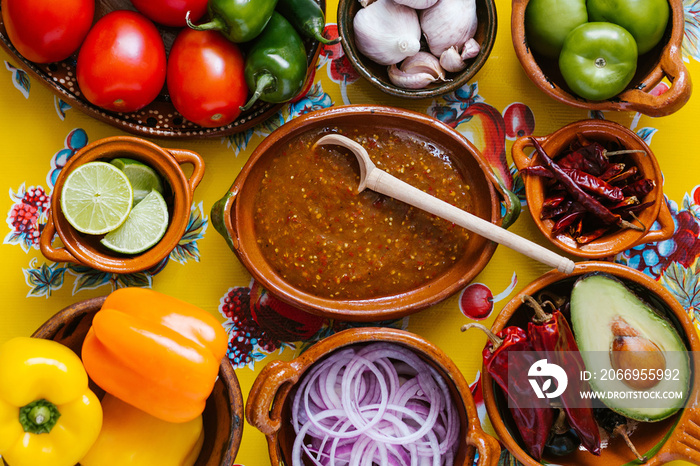 mexican salsa spicy sauce and ingredients on a table kitchen in Mexico city, Top view copy space.