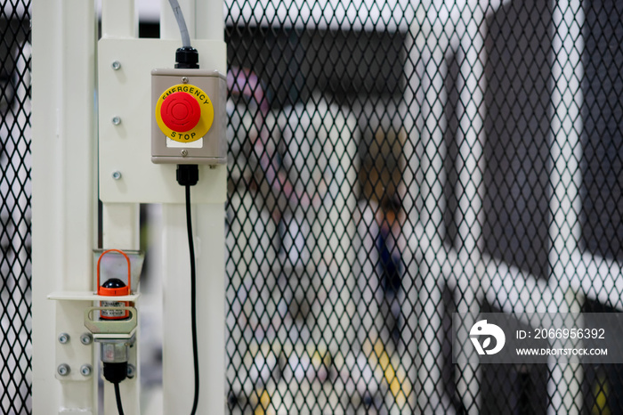 View of emergency switch on machine fence