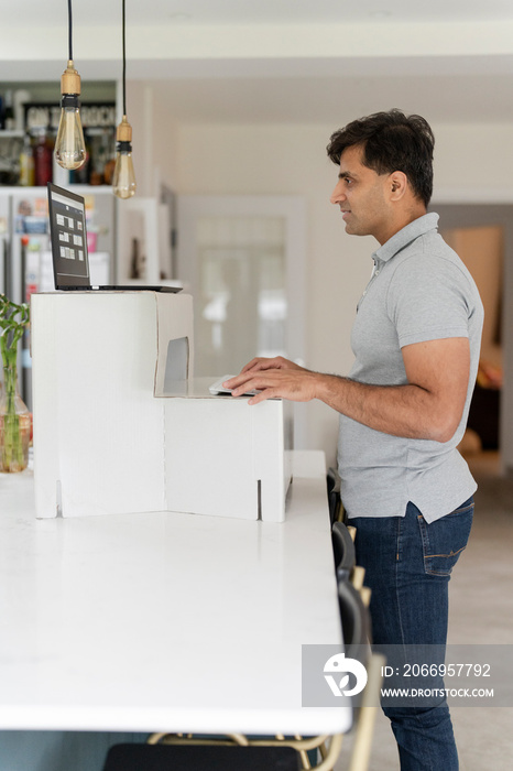 Man working on laptop at home