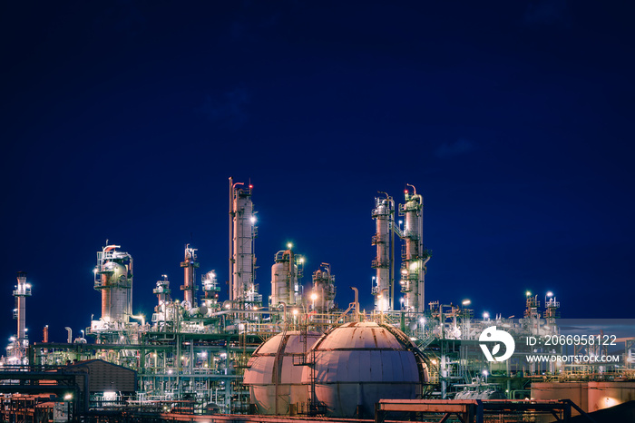 Petrochemical plant and storage sphere tanks with twilight sky background, Manufacturing plant of oil and gas refinery industrial, Glitter lighting of industry plant