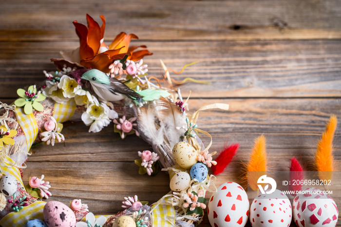 Easter wreath with eggs on a wooden background, concept of holidays