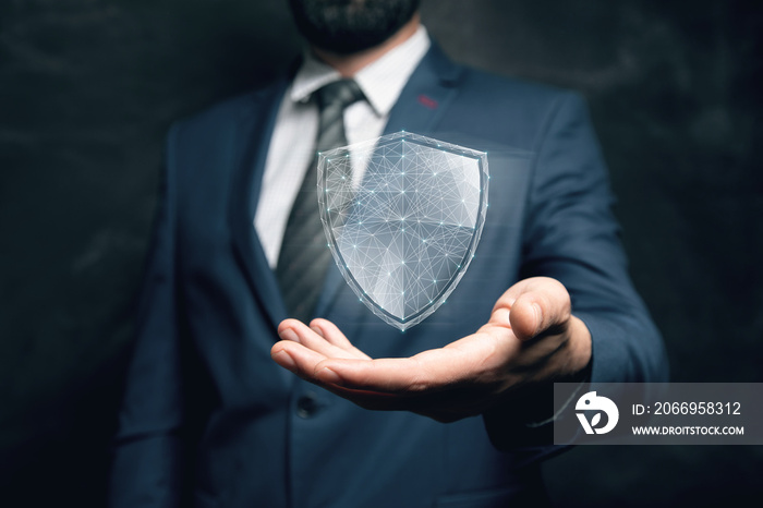 virtual shield from the network. cyber security concept. man holding in his hand