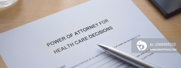 Power of attorney for health care decisions. Power of attorney form on the desk.