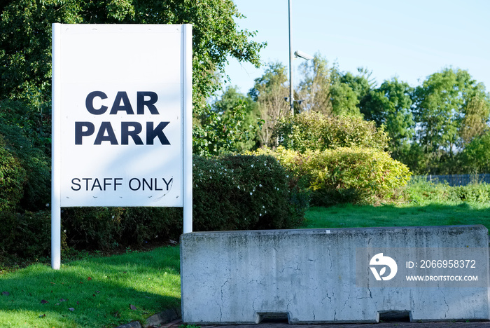 Staff only car park sign at business office workplace