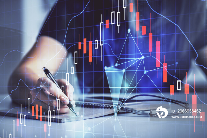 Multi exposure of woman’s hands making notes with forex graph hologram. Concept of technical analysis.