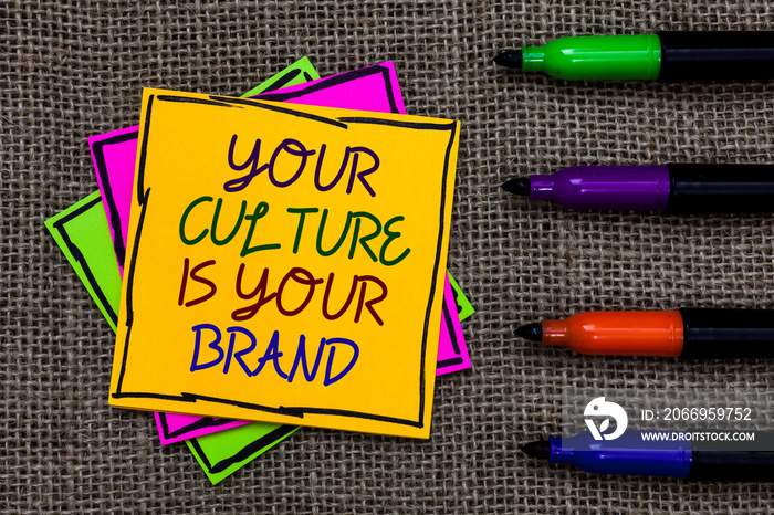 Text sign showing Your Culture Is Your Brand. Conceptual photo Knowledge Experiences are a presentation card Written on some colorful sticky note 4 pens laid in rank on jute base.