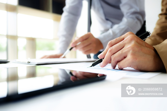 Accountant working with data documents calculating on business report.