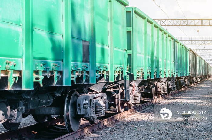 Railroad green cars on rails