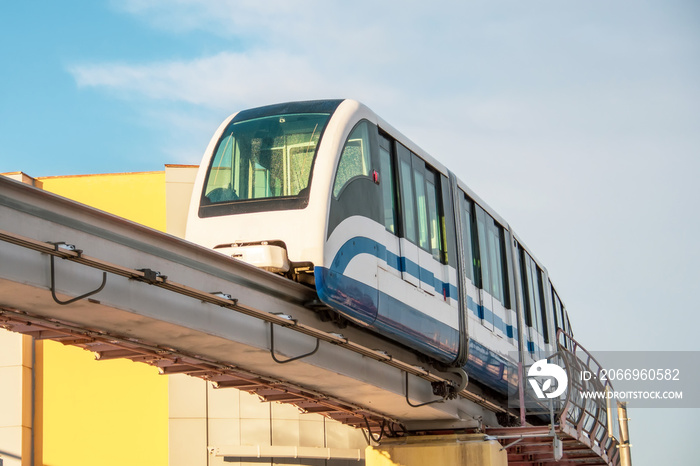 High speed subway train on the air bridge arrives at the station.