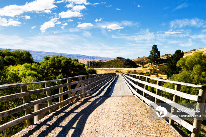 Cycling trail through farmlands and rural countryside of New Zealand