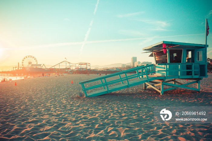 Iconic Santa Monica rescue cabin against famous amusement park in sunset