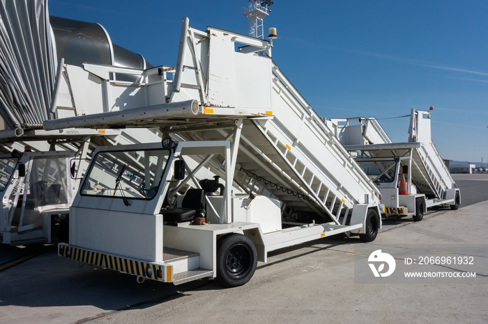 Gangways of airplan at the airport. Passenger’s boarding ramps. Passenger’s ladders. Traveling and waiting for flight at the airport