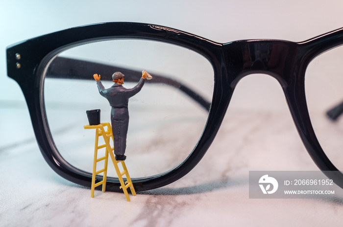 Tiny Figurine Cleans Eye Glasses