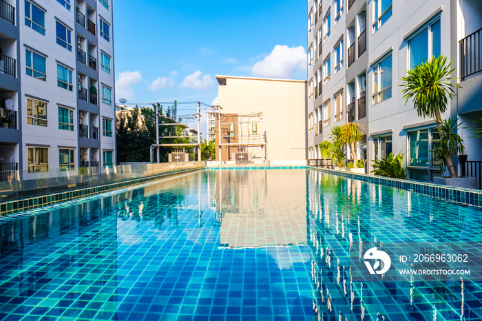 Luxury smimming pool inside of low rise condominium building