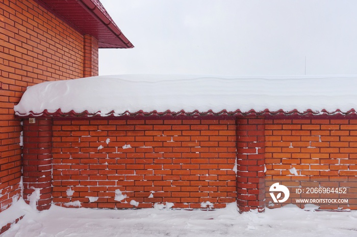 Red brick fence in the snow