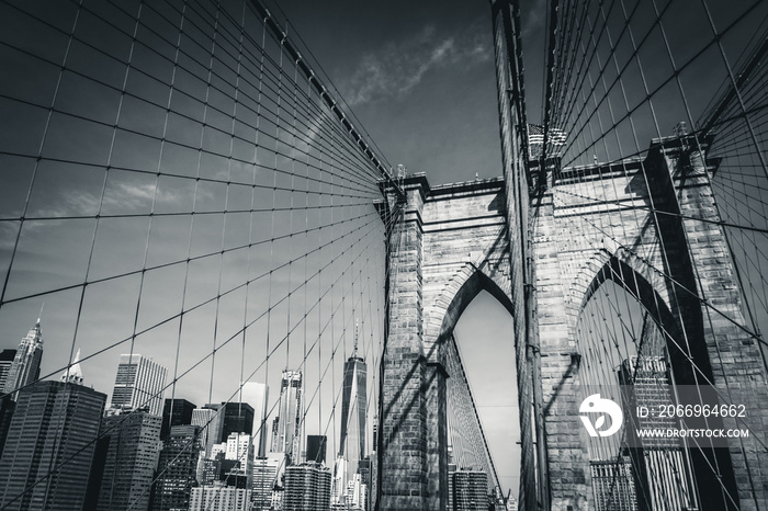 The Brooklyn Bridge in black and white with the new World Trade Center in the background, New York City, USA