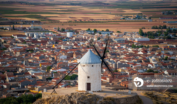 Spectacular isolated Consuegra old windmill and the city