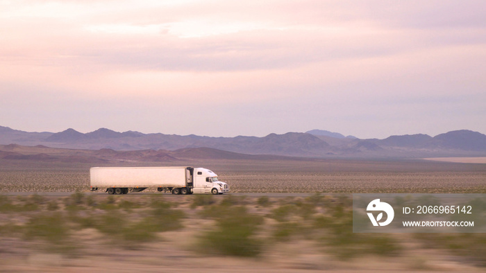 CLOSE UP: Freight semi truck driving and transporting goods on busy highway