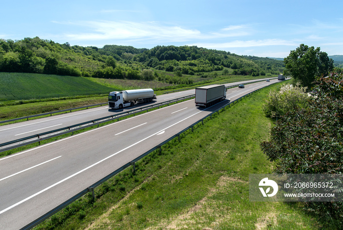 Isothermal Tank truck driving on highway. Oil and Gas. Transportation and Logistics.