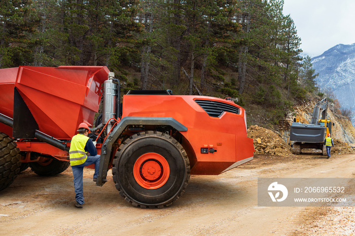 Engineer programs autonomous mining truck using digital tablet