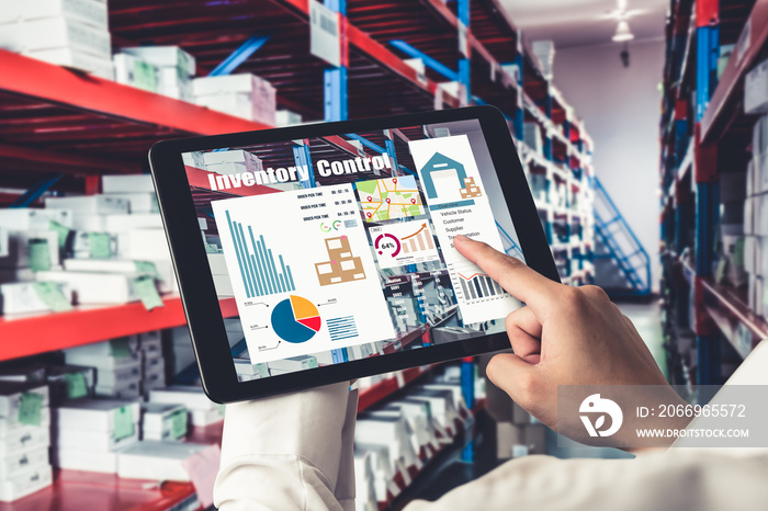 Warehouse management innovative software in computer for real time monitoring of goods package delivery . Computer screen showing smart inventory dashboard for storage and supply chain distribution .