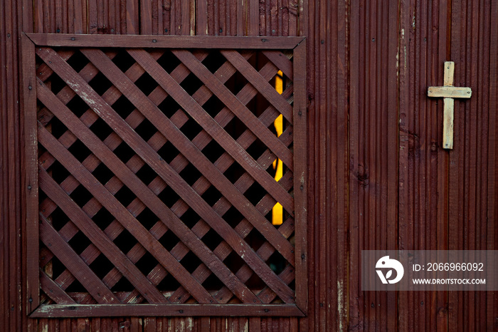 A Catholic wooden confession booth, empty, in close range, old one. Religion concept