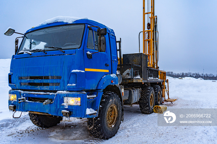 truck with drilling rig. Performing water well drilling and geological engineering surveys