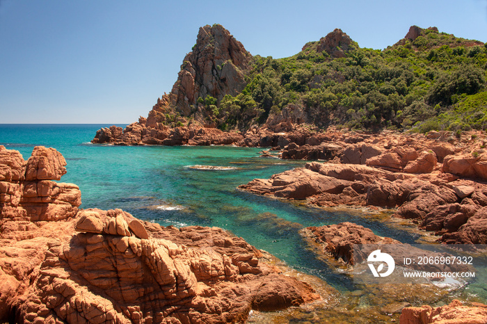 Su Sirboni beach, Sardinia. Marina di Gairo. Crystal clear waters with white sand and red rocks and junipers