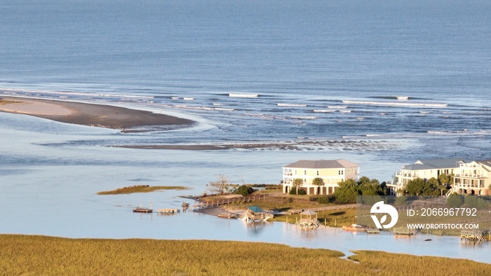 Coastline of Pawleys Island South Carolina a popular family vacation destination in the Grand Strand with beach houses and natural tidal marsh