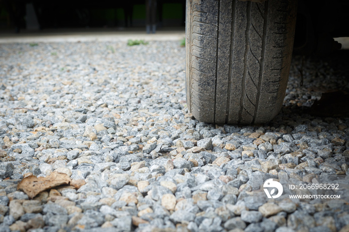 car wheel vehicle on gravel construction road