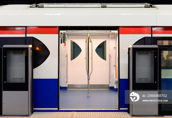 Train at station platform with open door