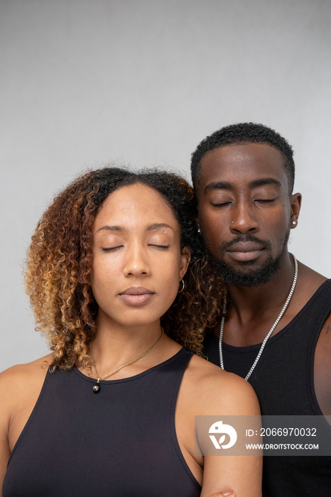 Portrait of couple with closed eyes