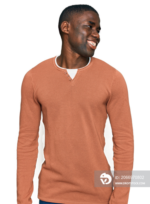 Young african american man wearing casual clothes looking away to side with smile on face, natural expression. laughing confident.