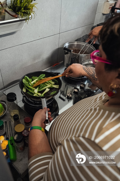 Plus sized parents making a healthy meal for the family