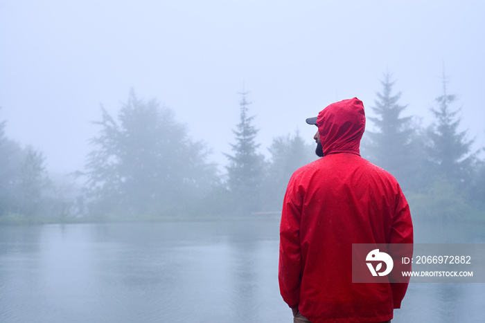 Traveler looking on the left near lake