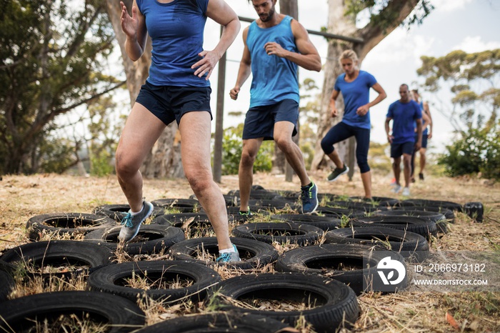 People receiving tire obstacle course training