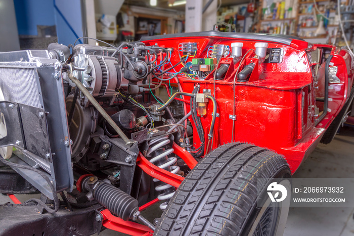 restoration of a vintage red vehicle