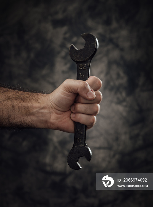 Worker holding a spanner