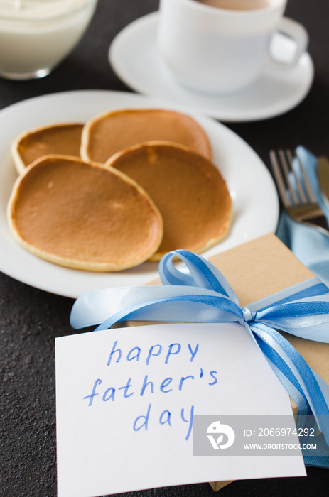 Pancakes and a cup of coffee for father. Father’s day concept.