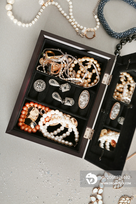 Jewelry accessories in box and table, top view