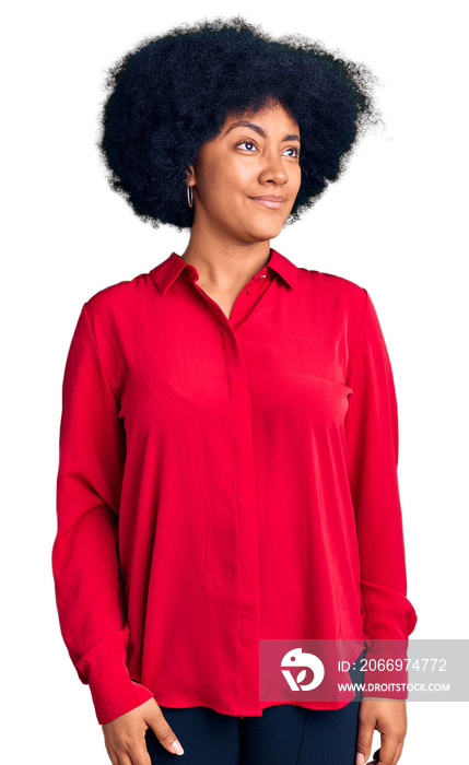 Young african american girl wearing casual clothes smiling looking to the side and staring away thinking.