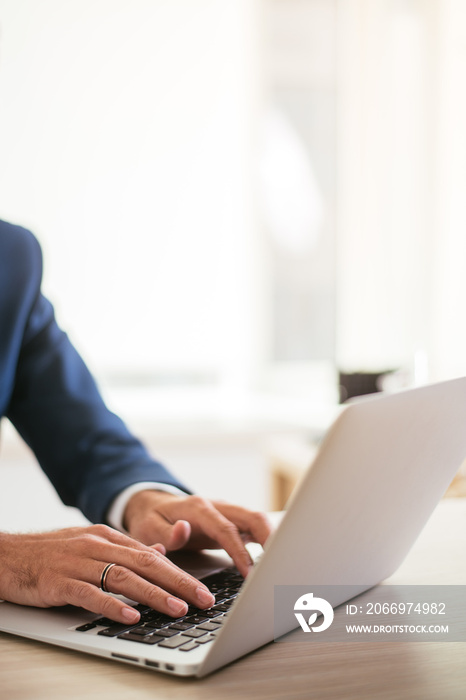 Typing on a laptop. Hands on a keyboard. Typing at the office.